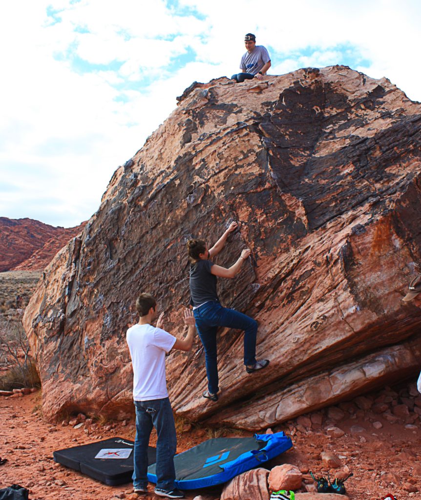 Bonnie climbing a Kraft Boulder