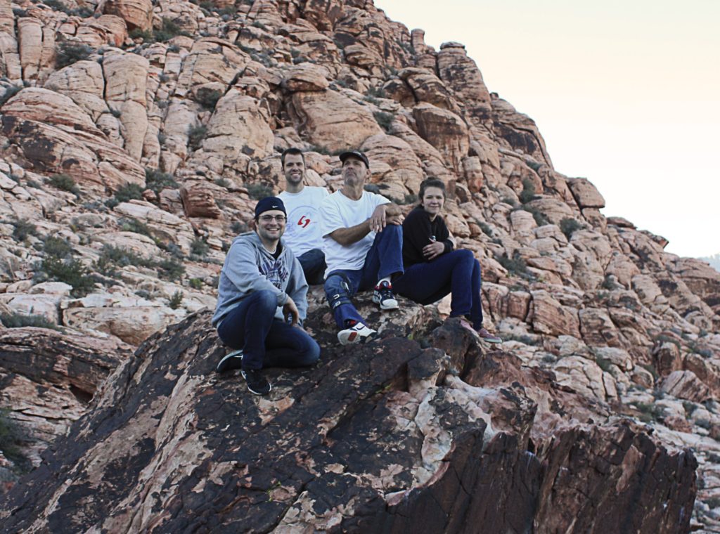 A group of climbers on top of a boulder