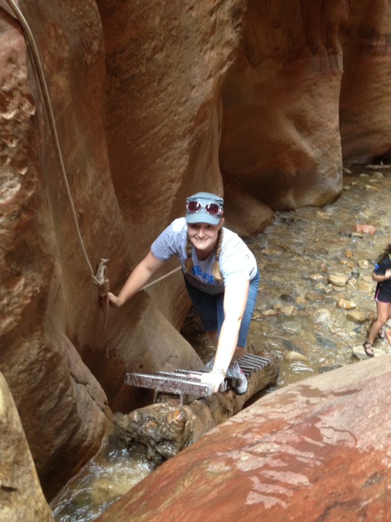 Meagan climbing the ladder up the falls