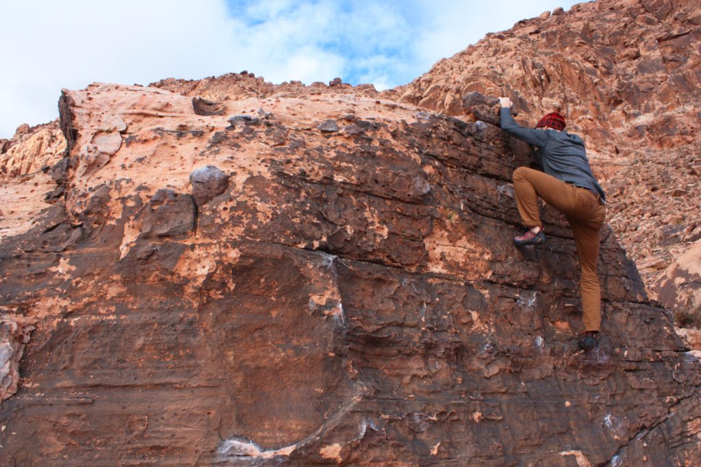 Ron Climbing a large Kraft Boulder