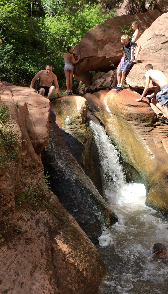 Ben sliding down the second Kanarraville Falls