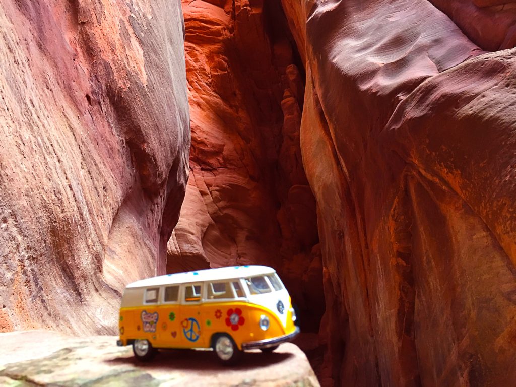 The yellow van in a gorgeous red slot canyon