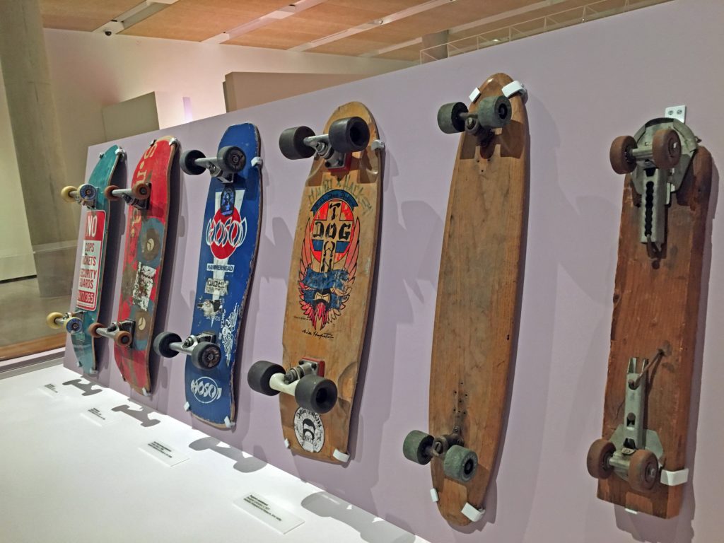 a lineup of skateboards in the California: Designing Freedom exhibit 