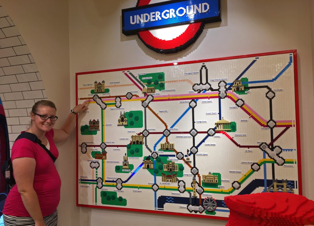 Meagan with a London Tube map made out of Legos