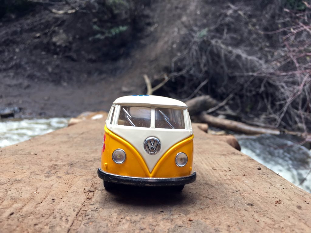 Yellow Van on log bridge