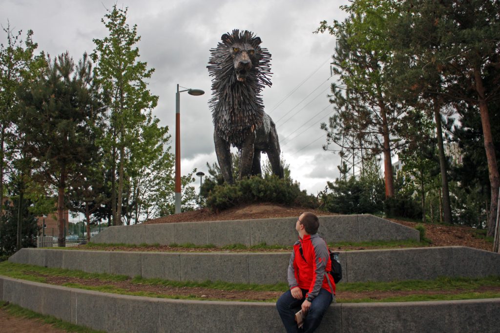 Ben looking at the Aslan sculpture at C.S. Lewis Square
