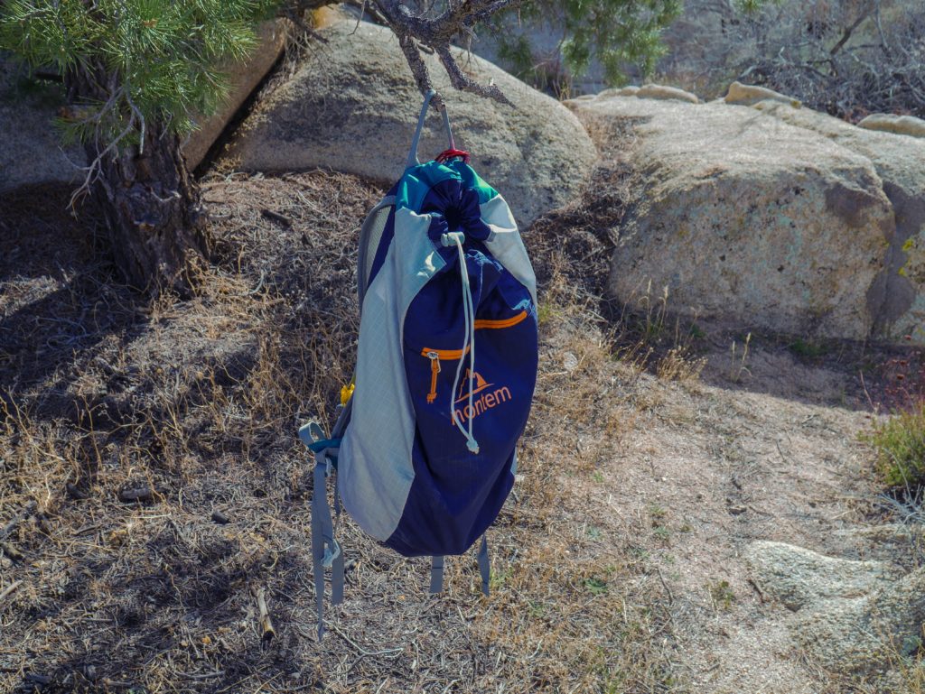 Montem diadem daypack hanging from a tree