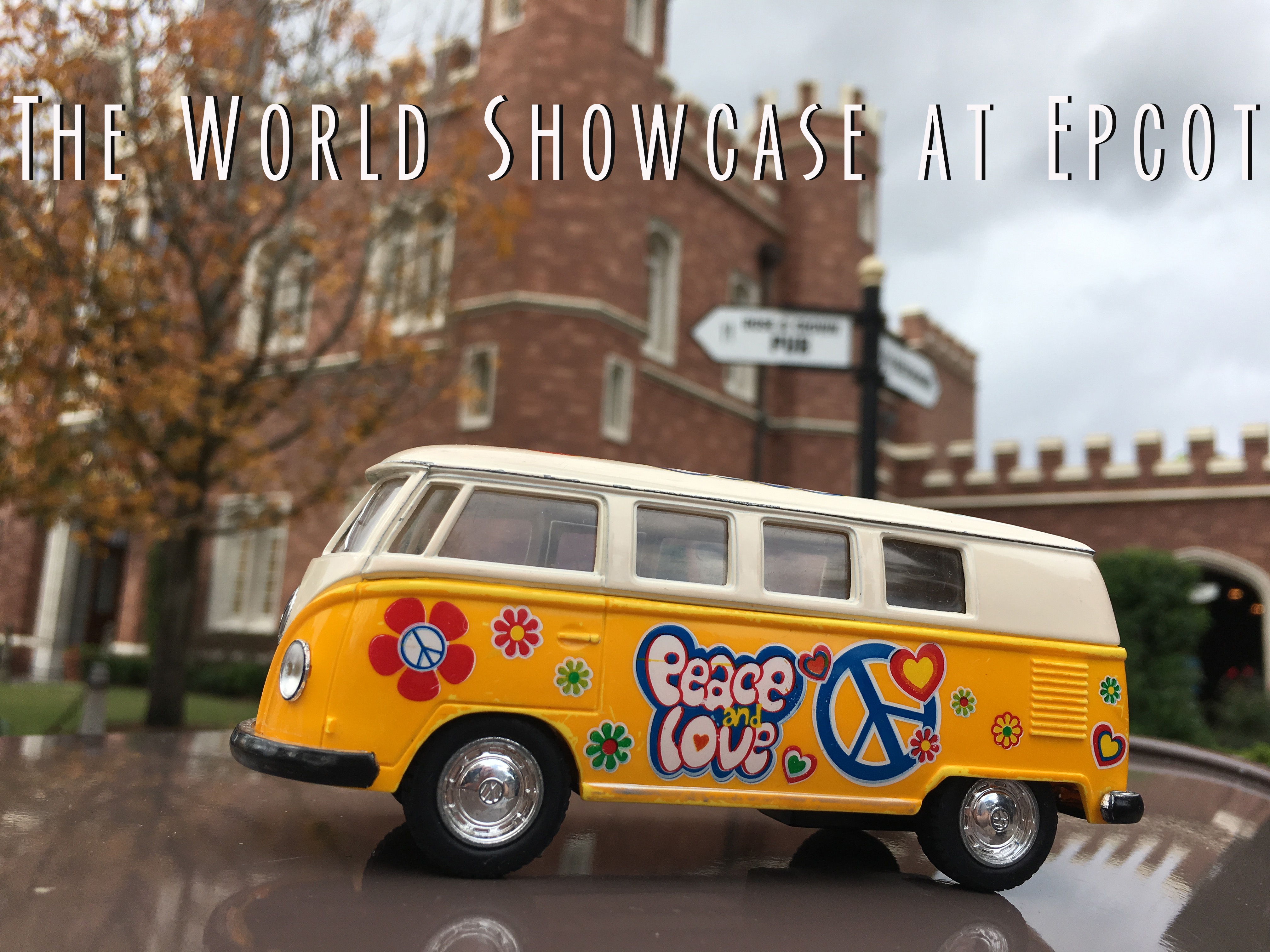 Title card for Epcot's World Showcase with the Yellow Van in front of a castle