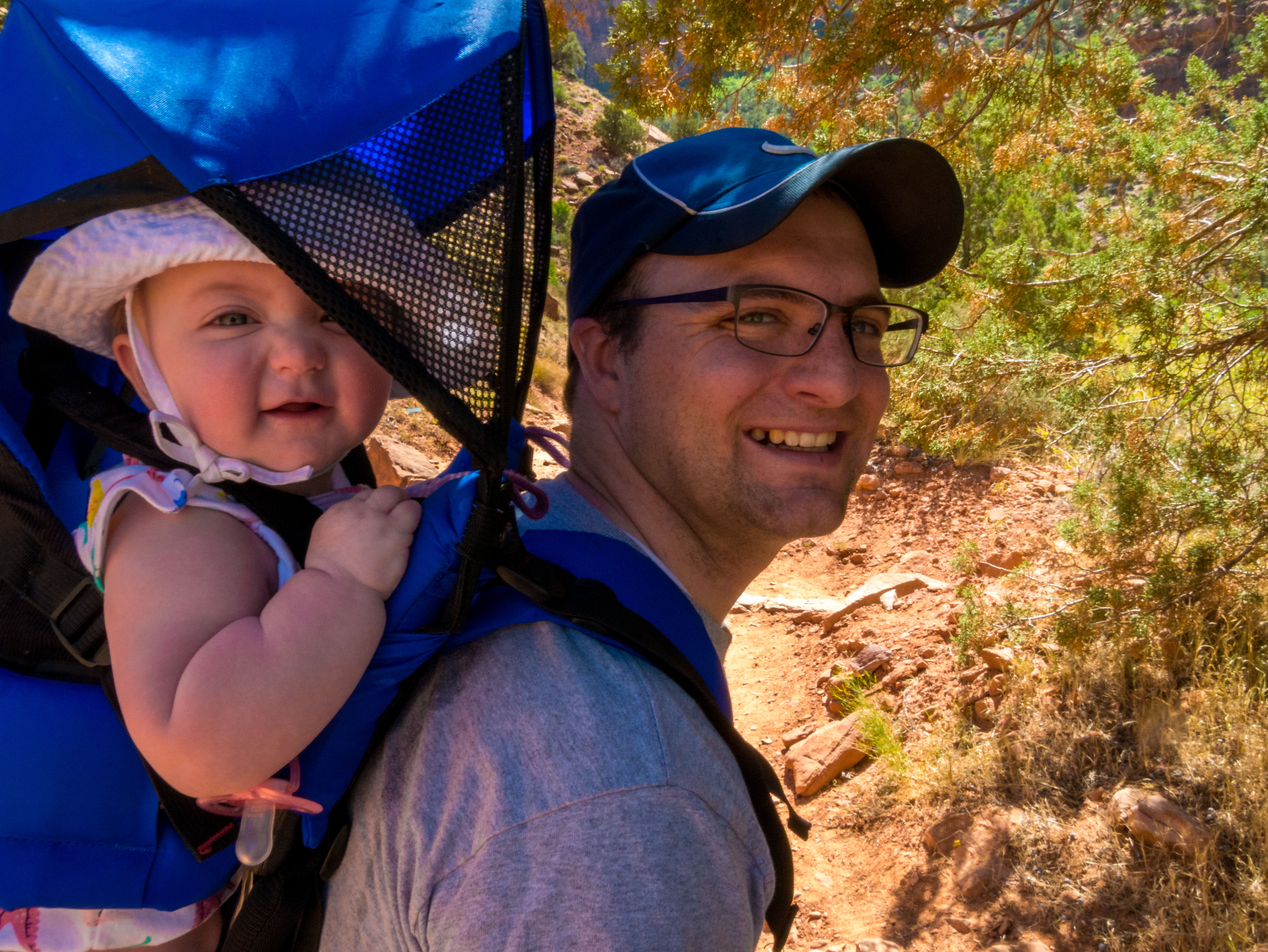 Ben and baby hiking Watchman Trail at Zion National Park
