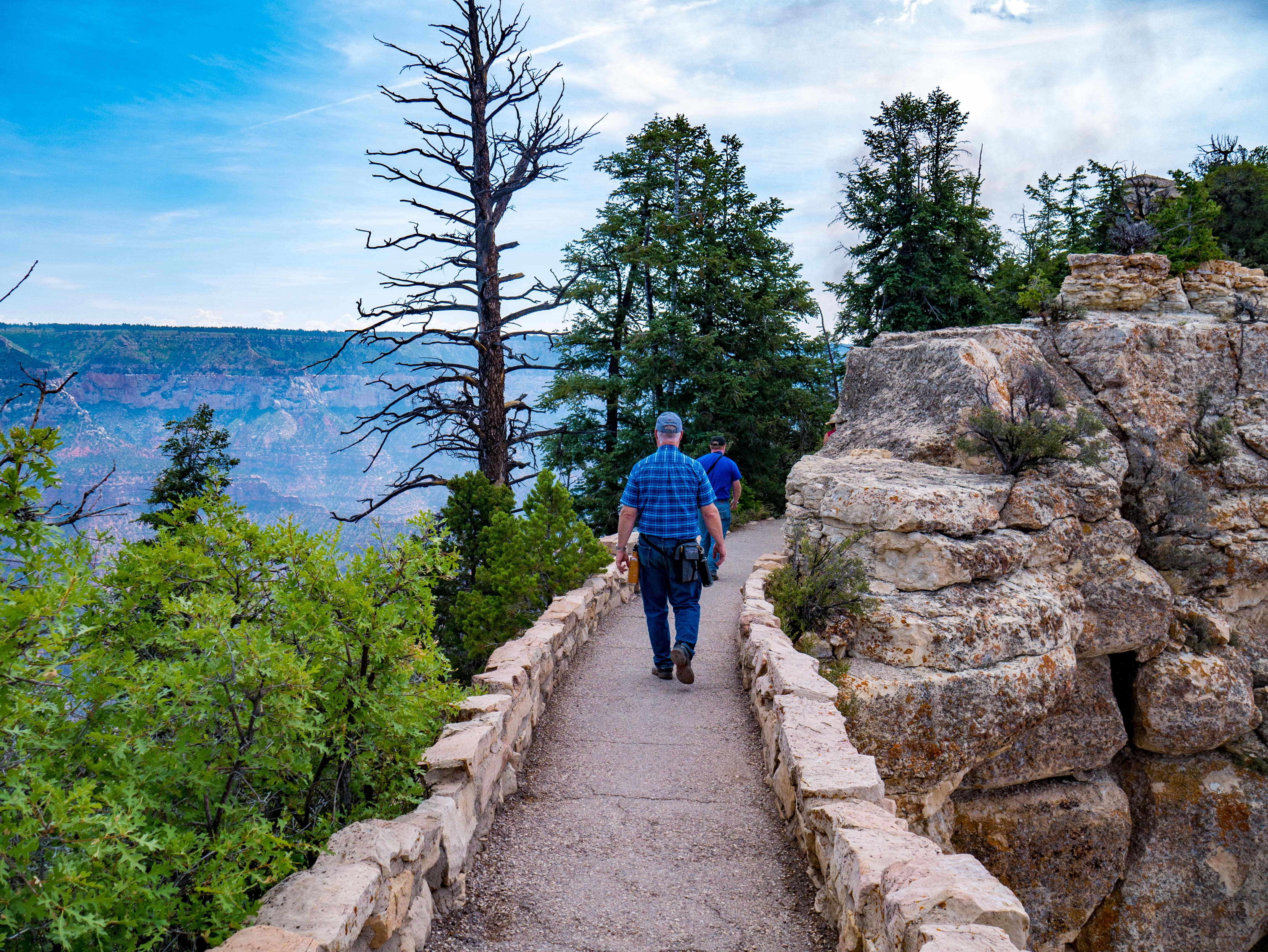 Man on the path to the Grand Canyon North Rim's Bright Angel Point