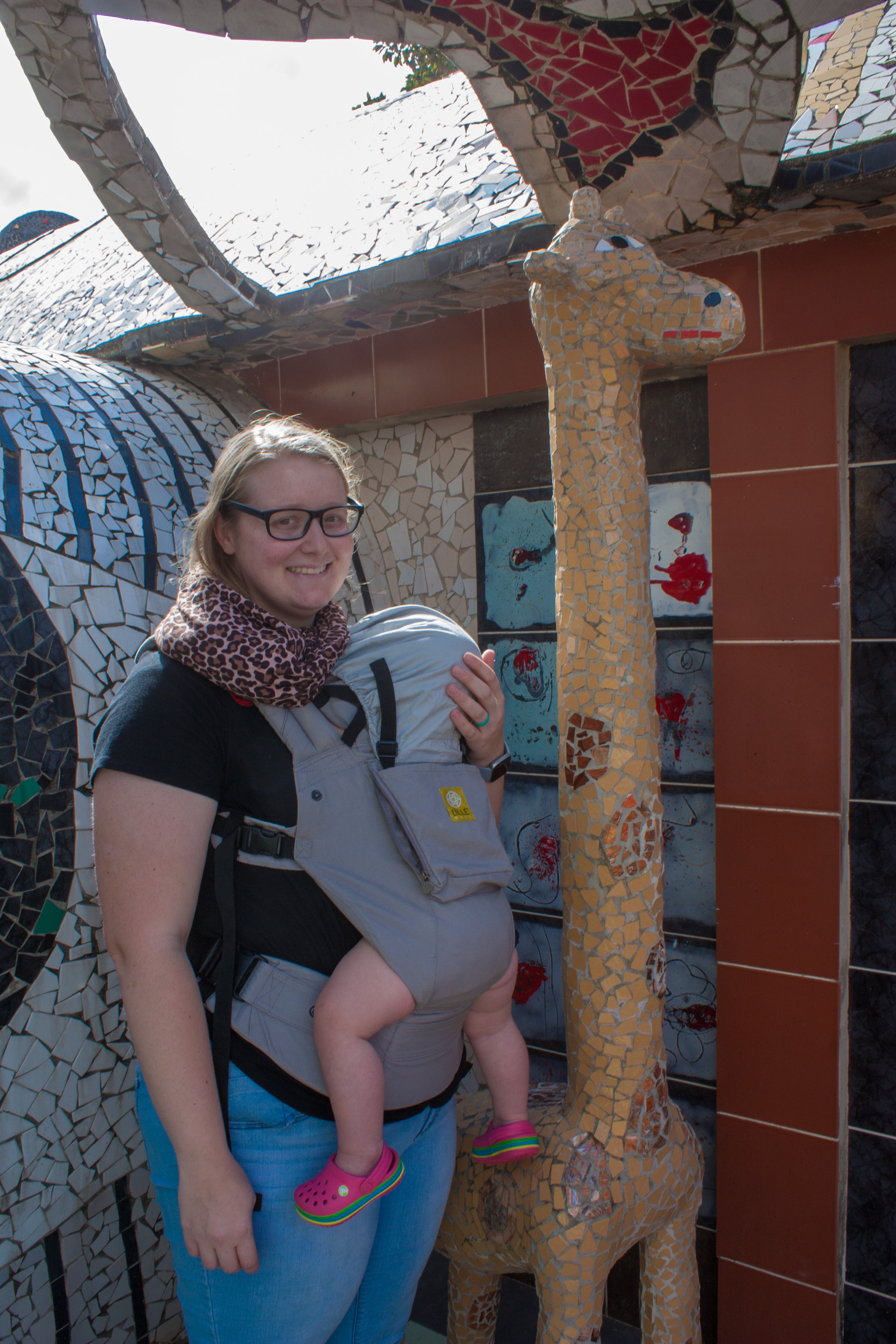 Meagan and baby with a giraffe mosaic in Fusterlandia in Havana Cuba