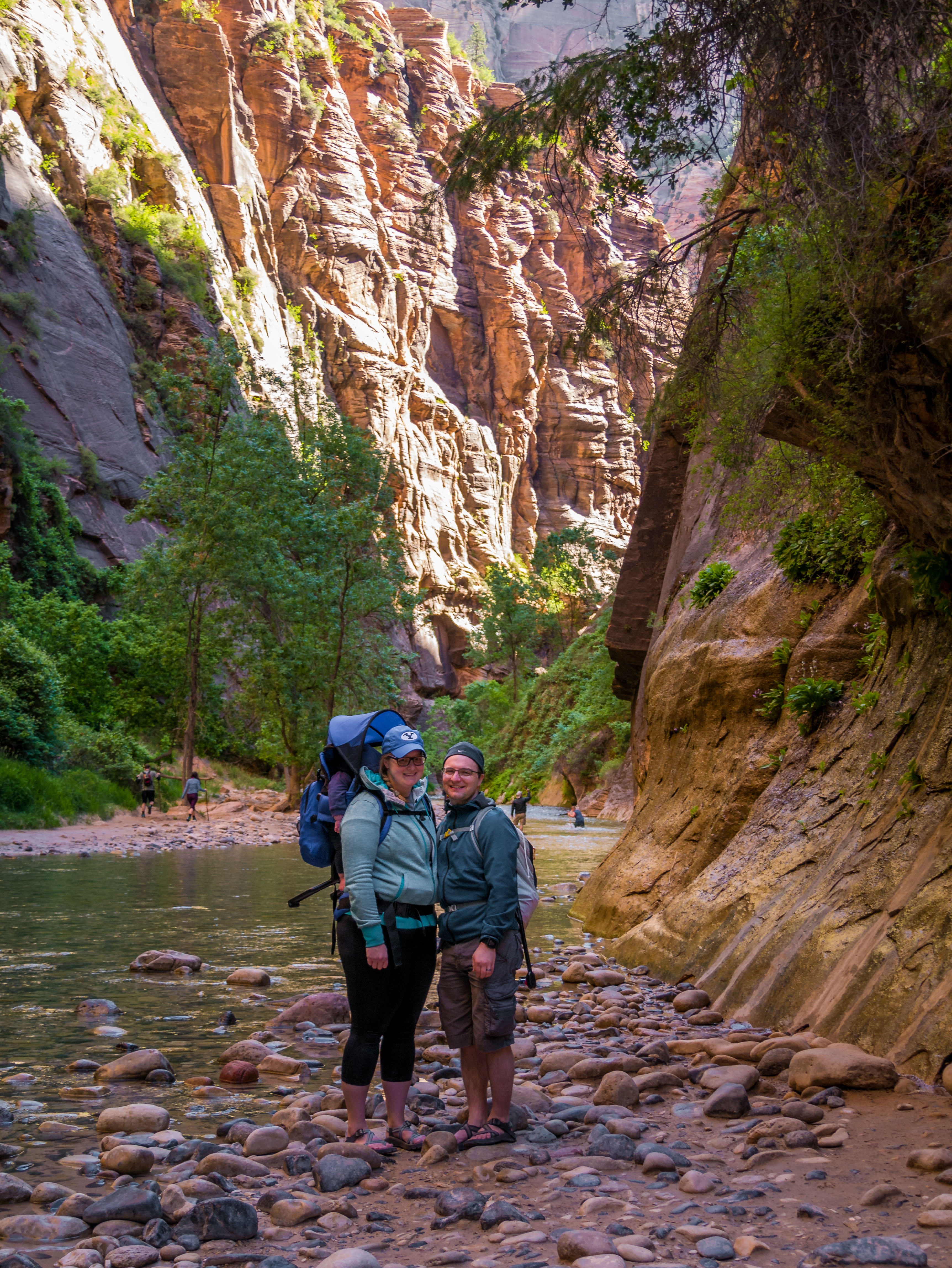 Family hiking with a baby in Zion narrows