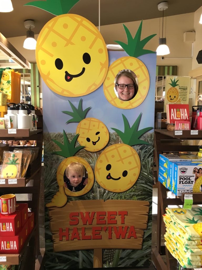 Meagan and Lucy at a Pineapple cutout sign in Hale'iwa