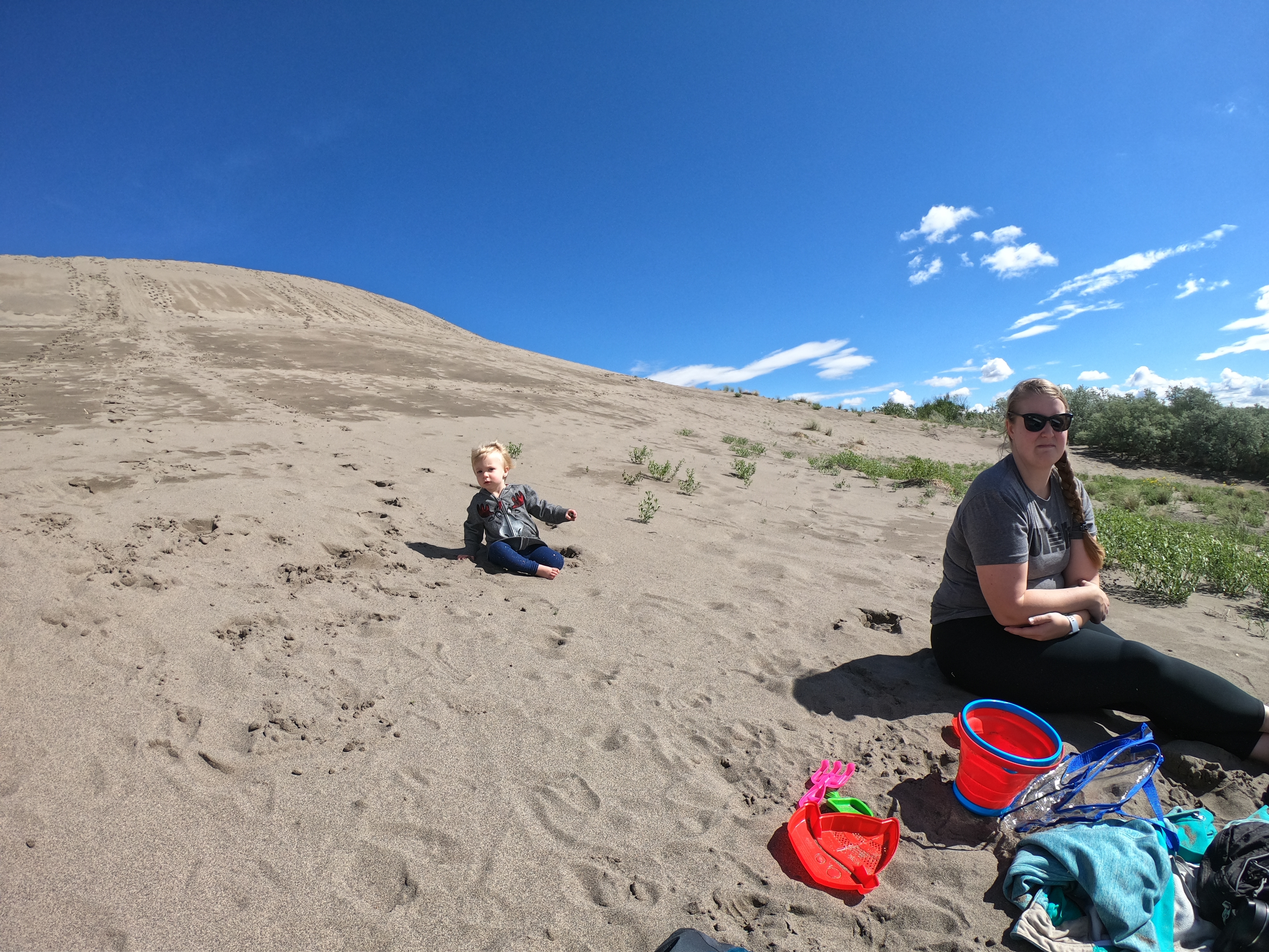 Baby playing in sand at the Bruneau Dunes