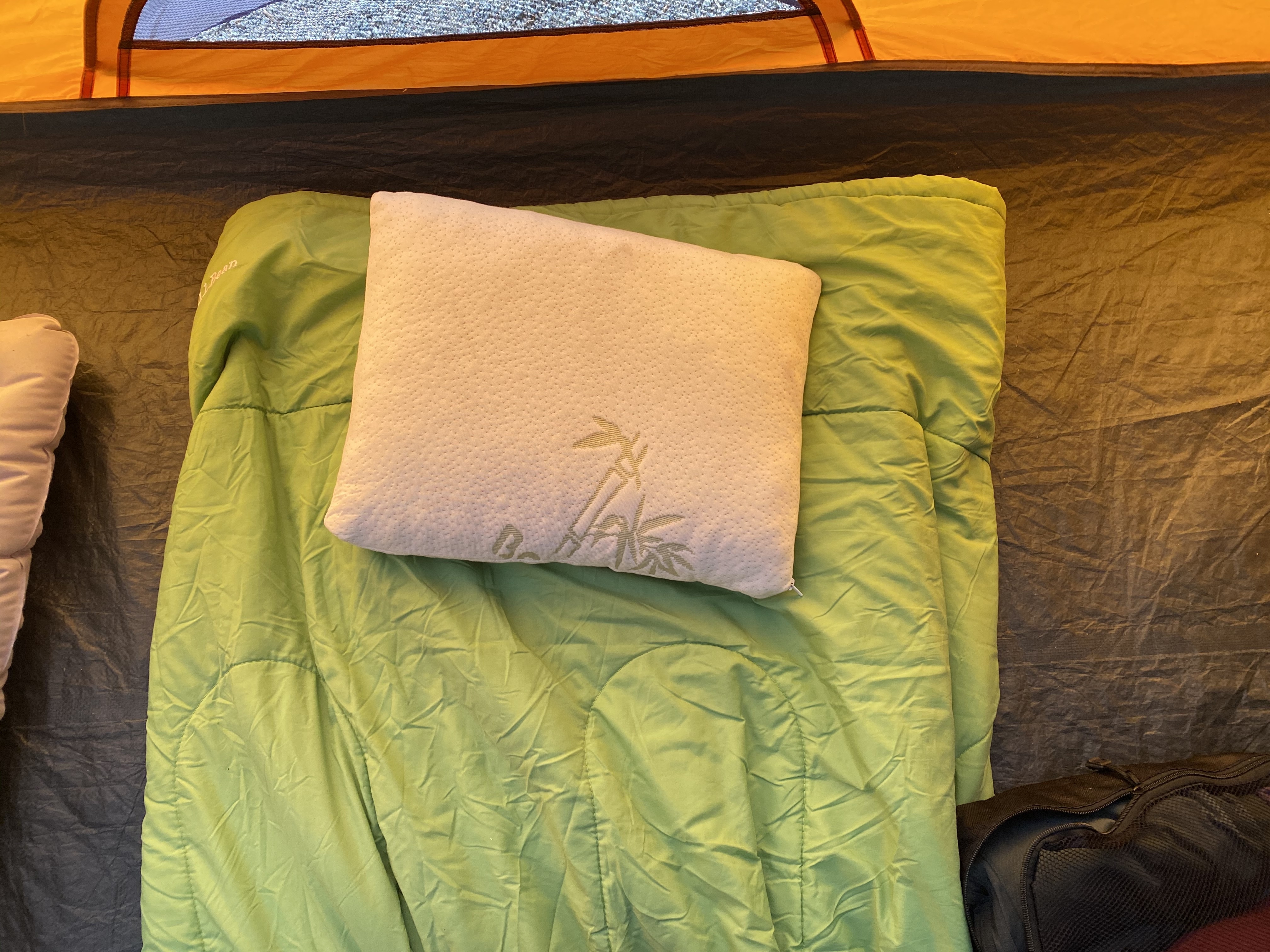 The Outbright Camping Pillow on a sleeping bag